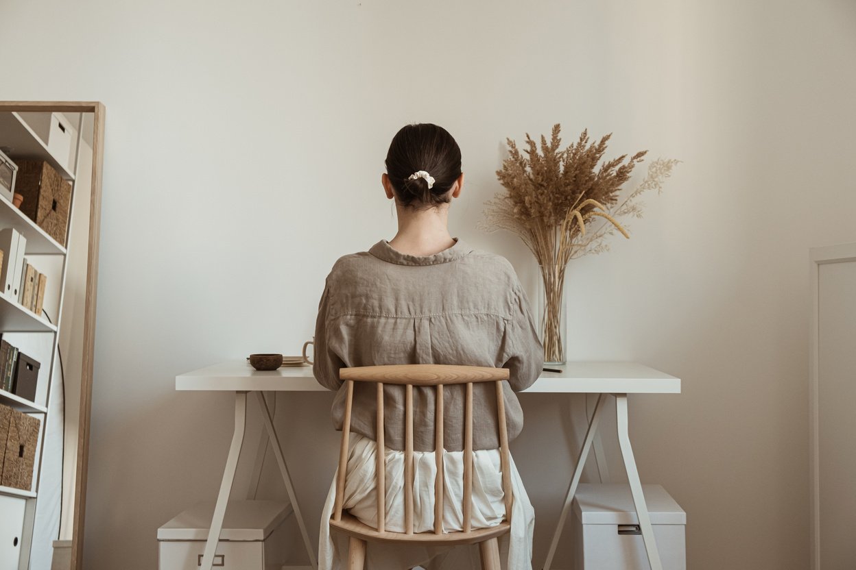 Woman Working in a Minimalist Home Office